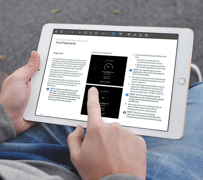 person using a touch-screen tablet to compete a maintenance e-learning module